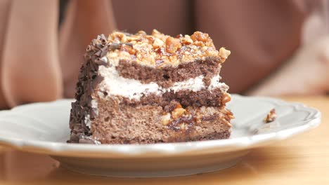 Chocolate-and-cream-cake-on-a-plate-on-table