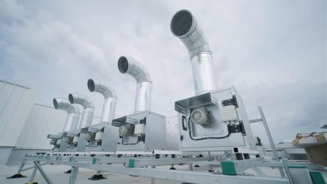 the air conditioning and ventilation system of a large industrial facility is located on the roof. it includes an air conditioner, smoke exhaust, and ventilation.