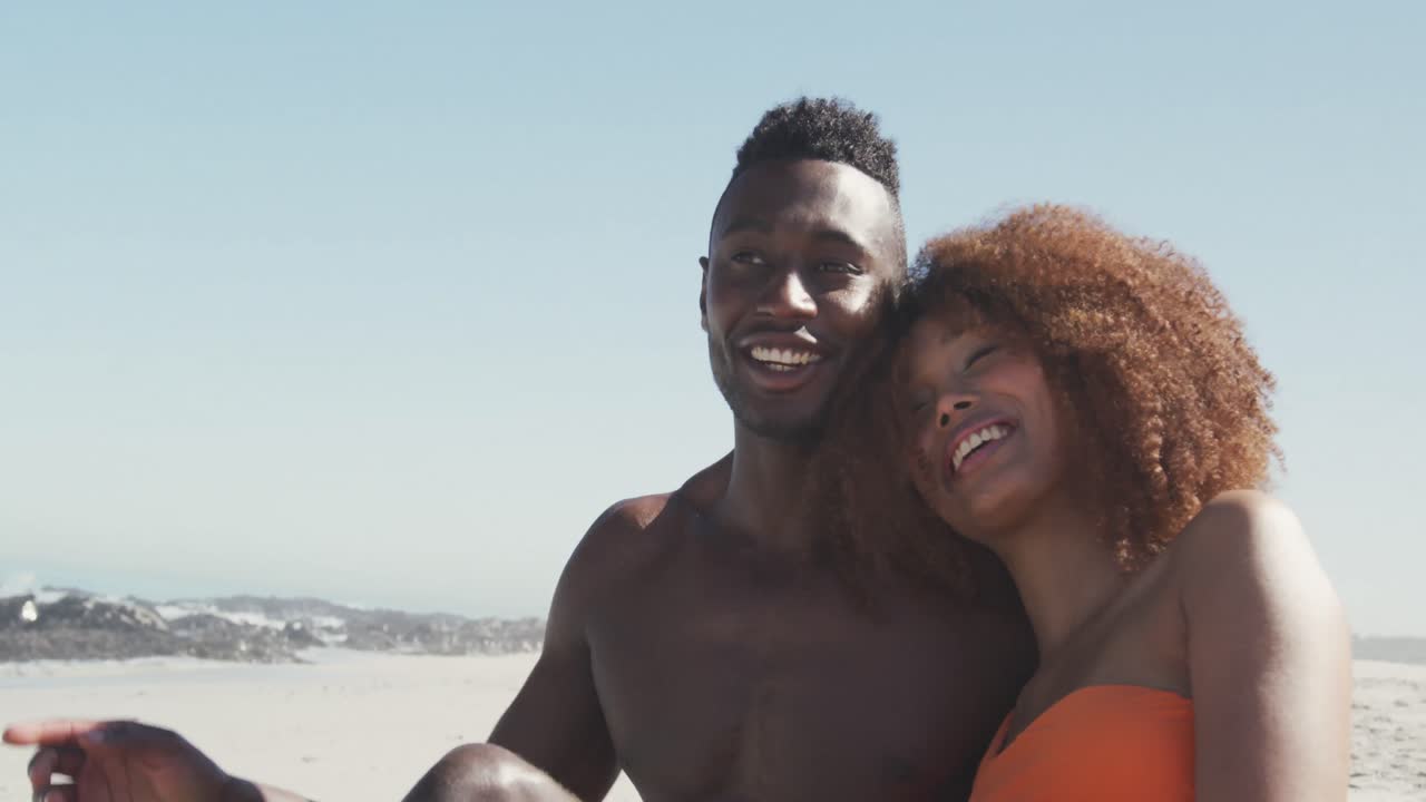African American couple enjoying sea view
