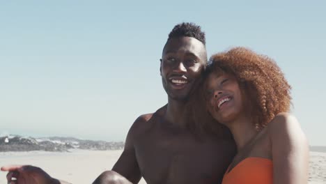african american couple enjoying sea view
