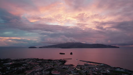 Colourful-sky-with-clouds-at-sunset-above-ocean-and-islands