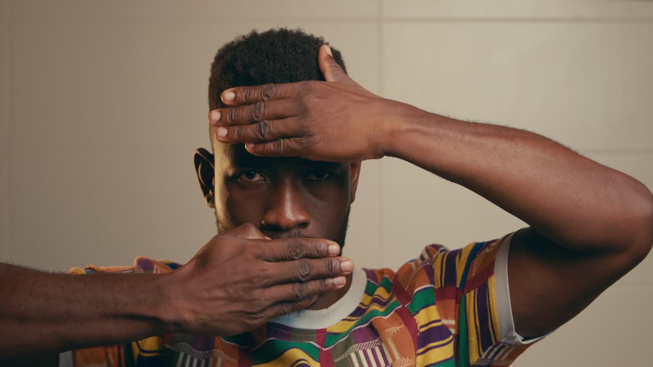 Portrait Of Bearded African American Man Slowly Revealing His Face
