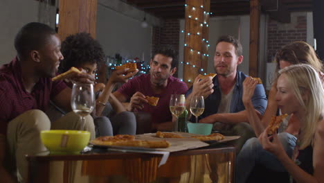 young adults sharing pizzas at a party at home, shot on r3d