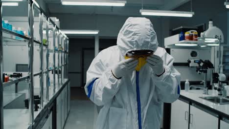 scientist in protective gear in a laboratory