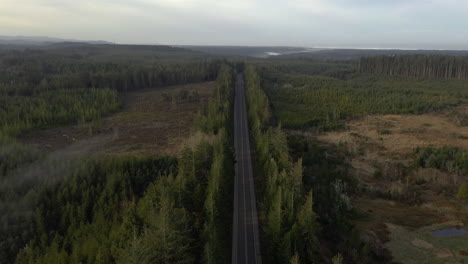 Static-Aerial-shot-of-Highway-near-Coos-Bay,-Oregon,-with-deforestation-scene