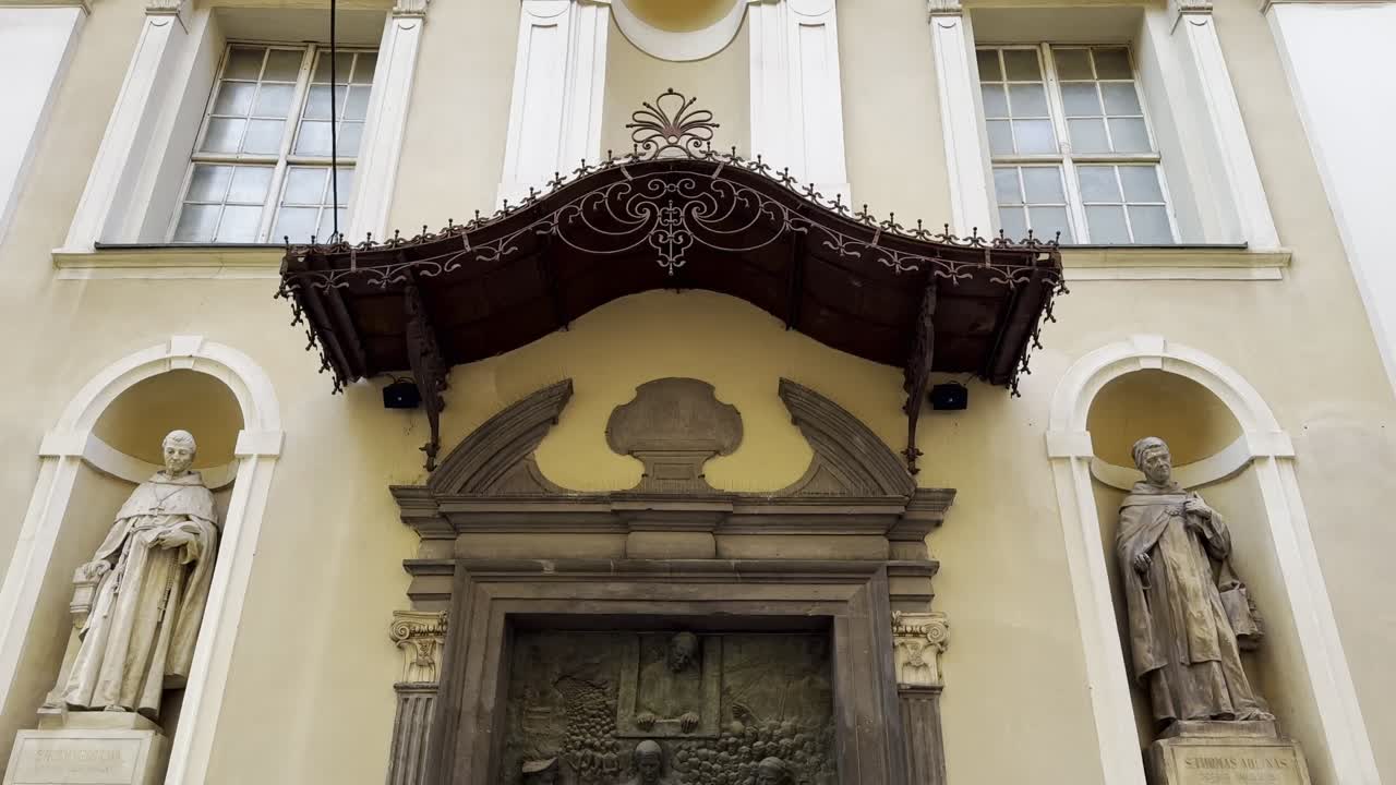 Pan down to reveal iconic Slovene Door on St Nicholas' Cathedral which depicts religious history and cultural heritage of Slovenia