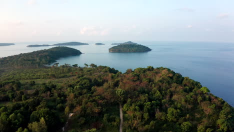 aerial drone footage showing flying over an island archipel in cambodia during sunrise