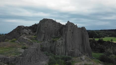 panska skala, a geological basalt formation in the czech republic, drone orbit and fly up, 4k or uhd, 30fps