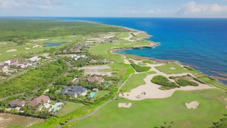 panoramic view over los corales golf course in punta cana, dominican republic - aerial drone shot