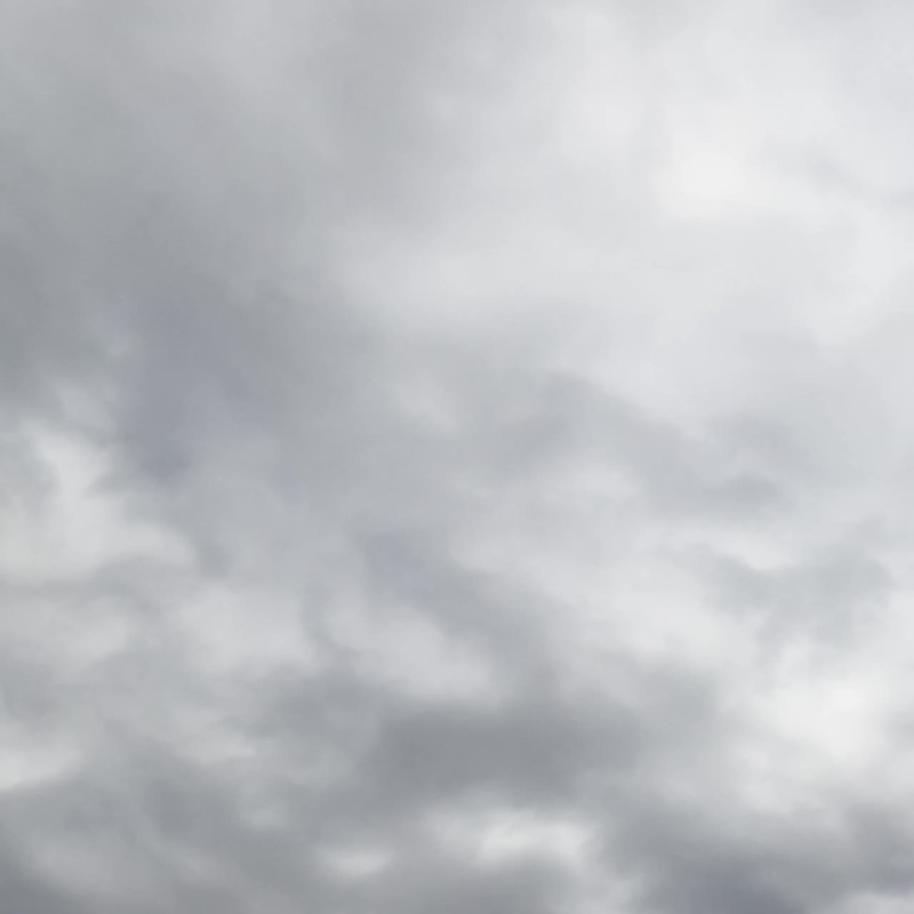 Dramatic cloudscape forming in the skies. Rainy clouds move in the atmosphere. Low angle view. Timelapse