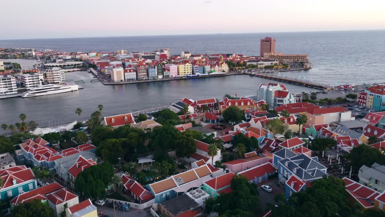 Establishing Otrabanda Flyover with a view on St. Anna Bay and Curaçao Punda Historical Unesco Colorful Buildings in 4K
