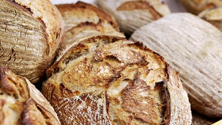 Fresh loaves of sourdough bread displayed for sale