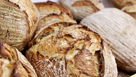 fresh loaves of sourdough bread displayed for sale