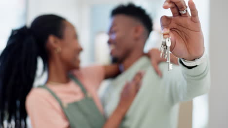 Hands,-couple-and-keys-in-new-home-for-moving
