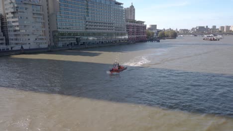 Royal-National-Lifeboat-Institution-RNLI-inflatable-boat-on-river-Thames,-London-England