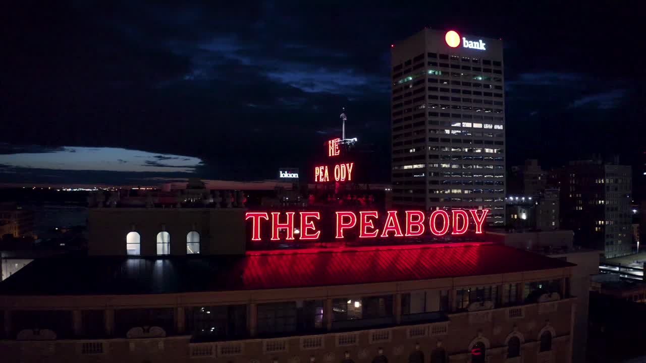 4k Aerial Nighttime View of The Peabody Hotel in Downtown Memphis, TN