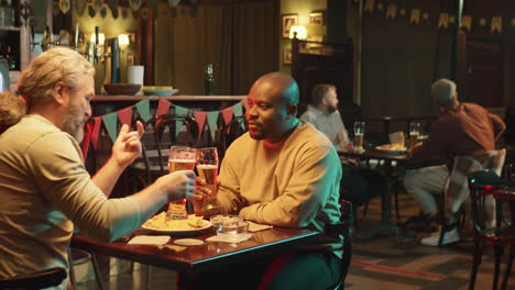 two friends spending evening in pub