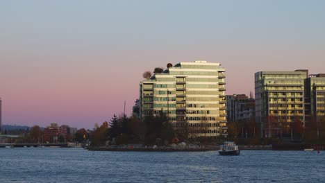 Rainbow-sky-during-sunset-behind-modern-building