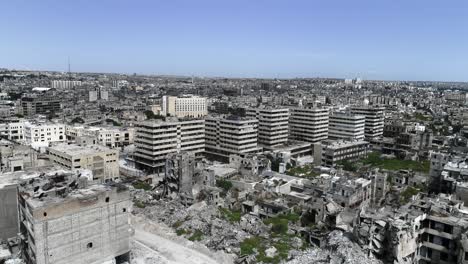 aleppo under the sunlight in aerial view. we can see the ruins of the syrian city all over the horizon 4k