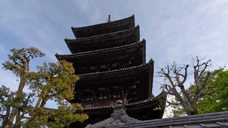 Kyoto,-Japan---Yasaka,-A-Five-story-Pagoda-Stands-Close-to-the-Pathways-of-Sannenzaka-and-Ninenzaka,-Which-Lead-to-Kiyomizu-dera-Temple---Low-Angle-Shot