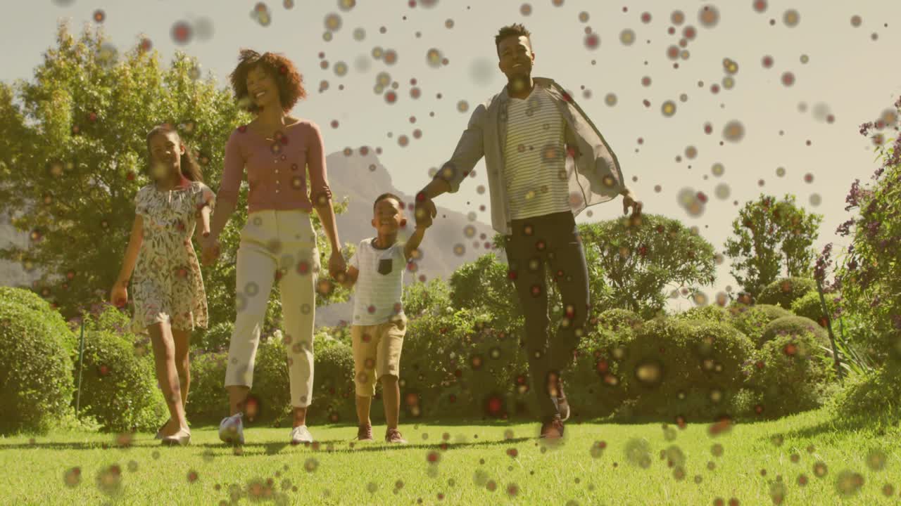 Camera tracking family walking across lawn, speckle overlay growing to obscure frame for marketing