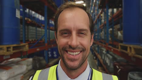 Portrait-of-male-manager-in-a-warehouse