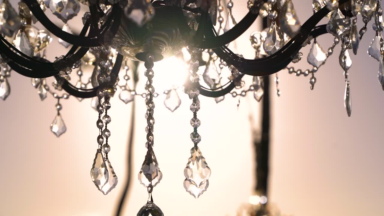 Chandelier sun flares through glass