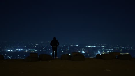 a nervous man on a cliff thinking about to commit suicide