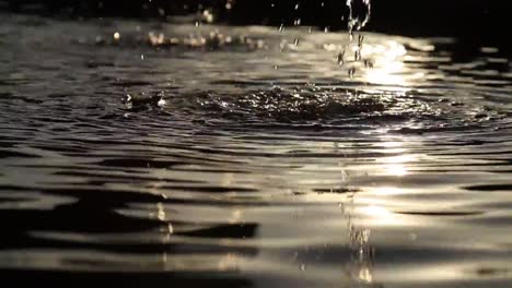 close up footage of a small waterfall flowing over river