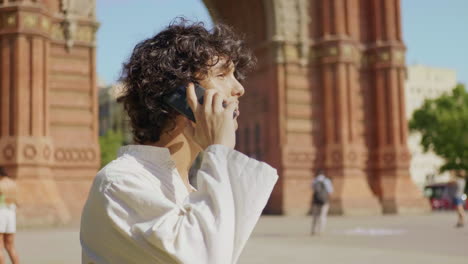 focused man calling mobile phone. portrait of smiling guy talking cellphone