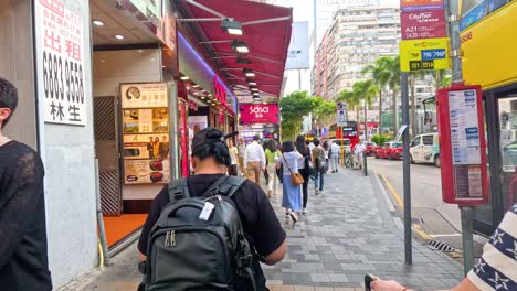 people walking along a vibrant city street