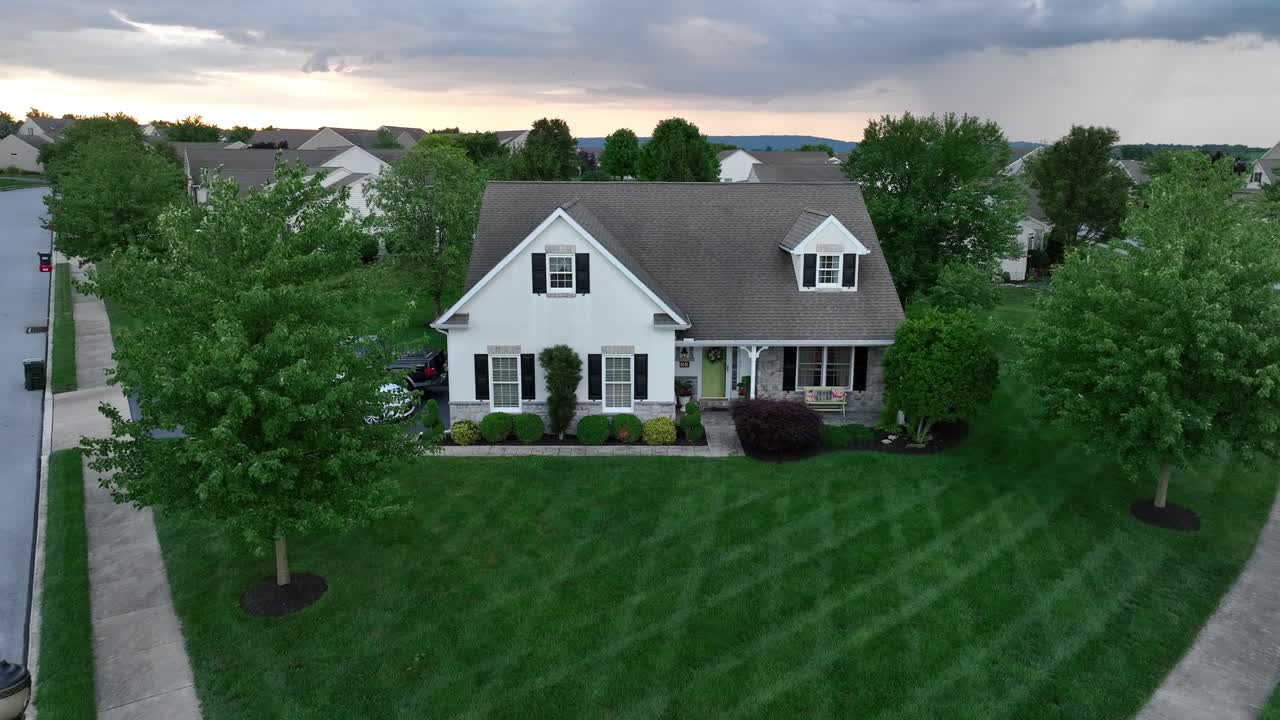 American home during stormy summer sunset