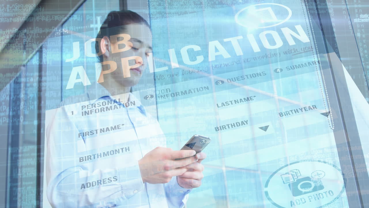 Man holding smartphone entering job application form in tech office, showing UI code overlays