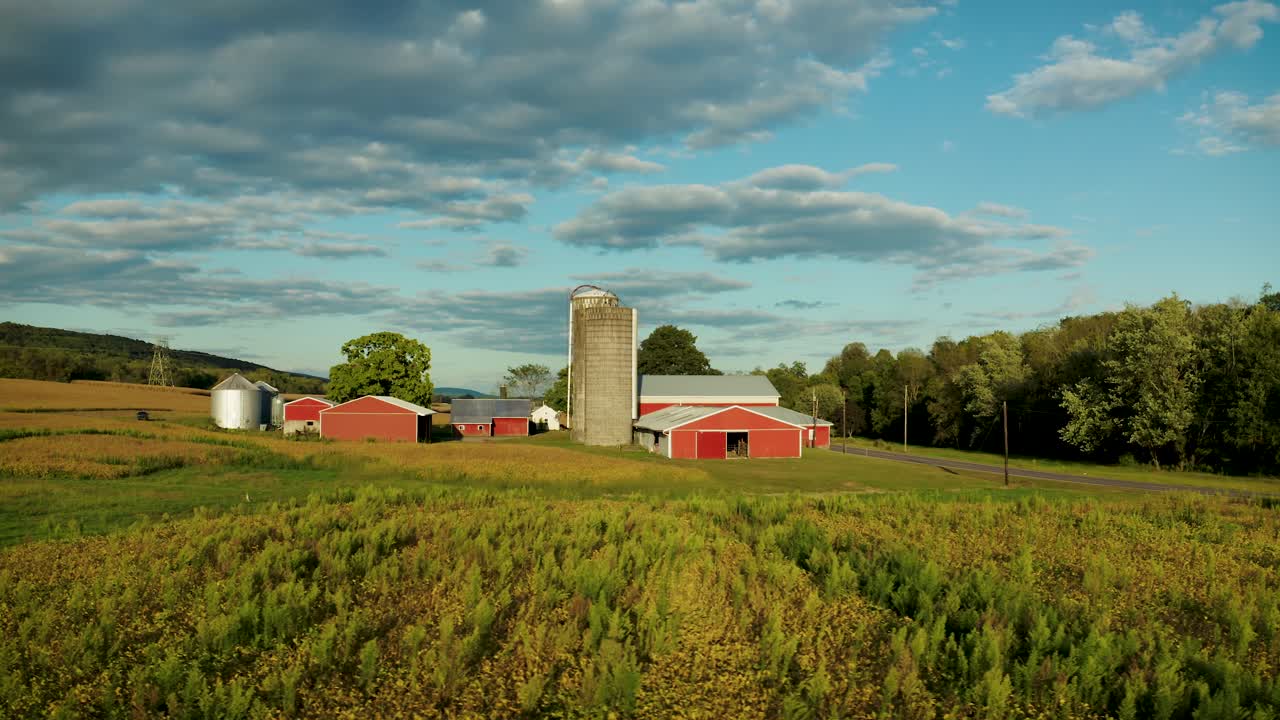 4K aerial footage of a farm on a beautiful sunny day