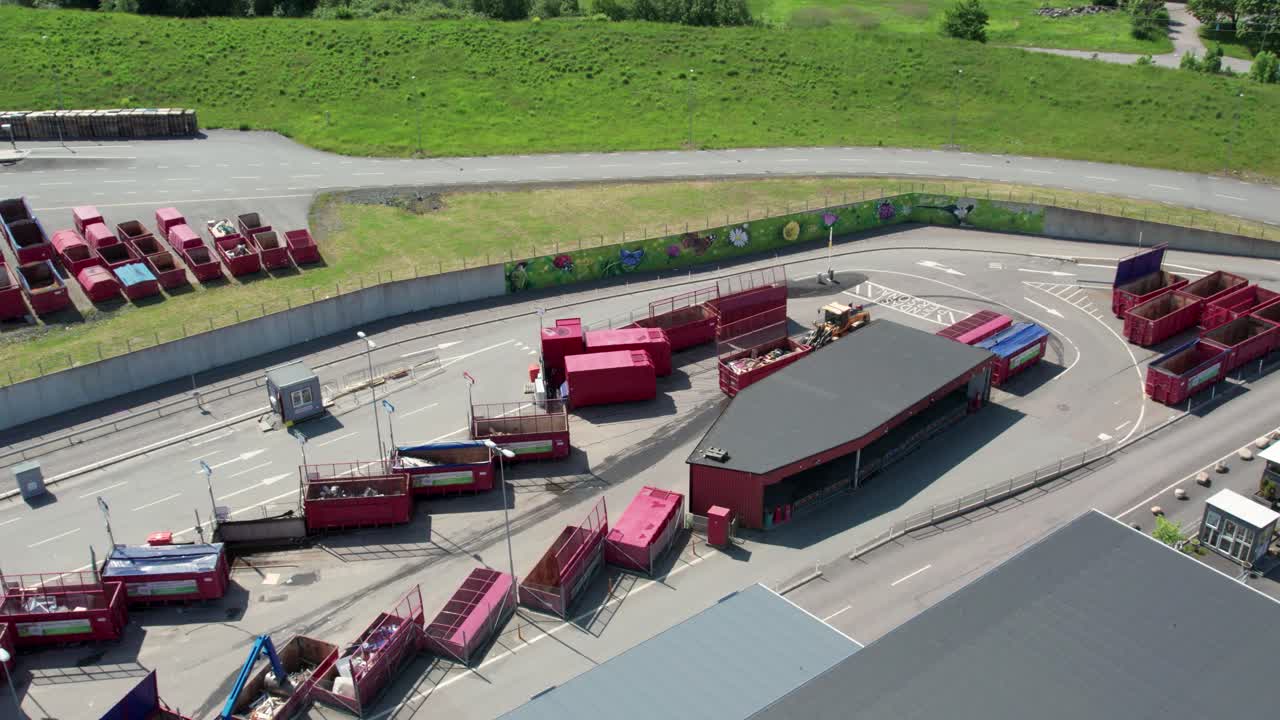 Tractor Placing Trash Bins in Kikas Recycling Center of Molndal, Sweden. Aerial