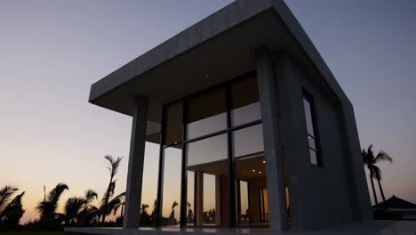 modern concrete house at sunset