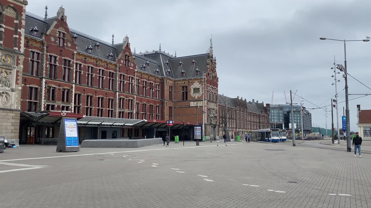 Still shot of the front of Amsterdam Central Station during the Coronavirus pandemic in the Netherlands