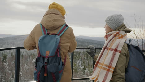 friends enjoying the snowy mountain view