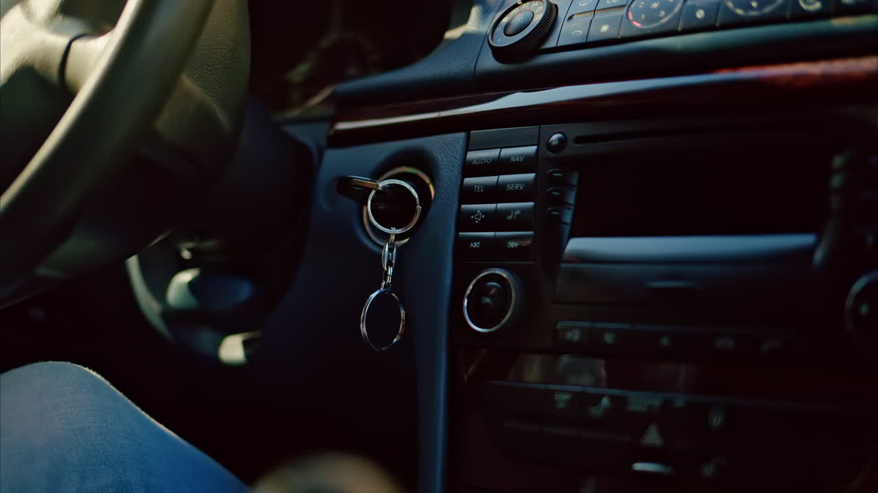 Person rotating the steering wheel while driving a car