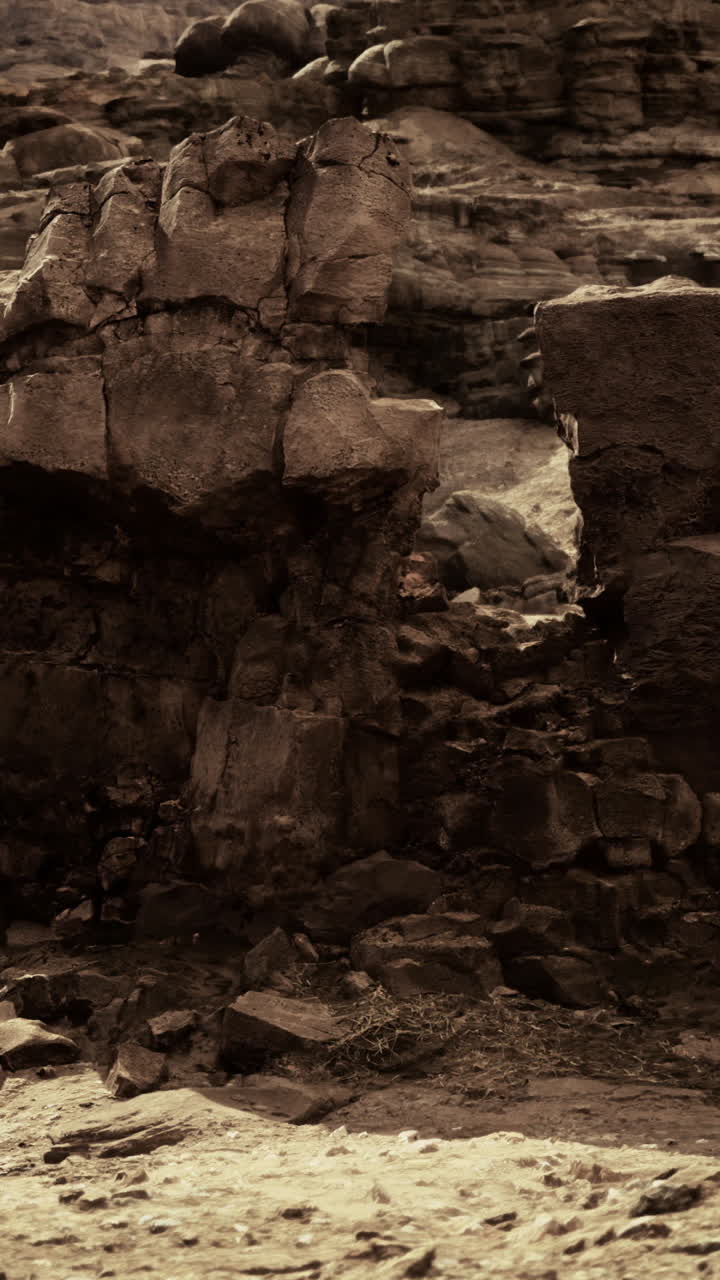 Rock formations exhibit unique textures and shapes in a rugged landscape