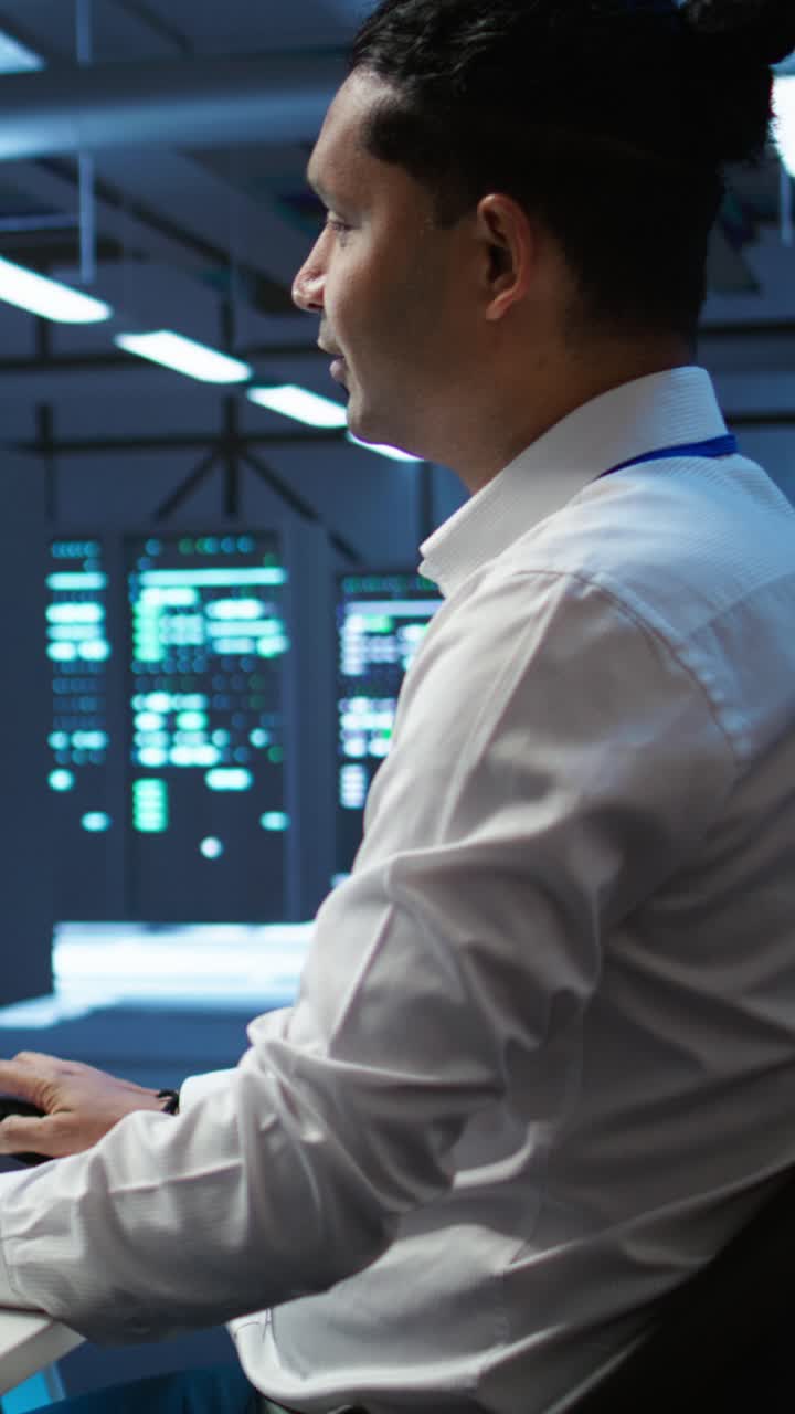 IT Professional Working in a Server Room Data Center