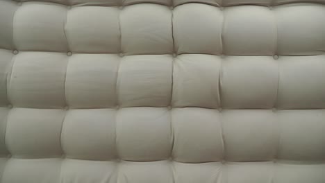 beige button tufted sofa upholstery texture