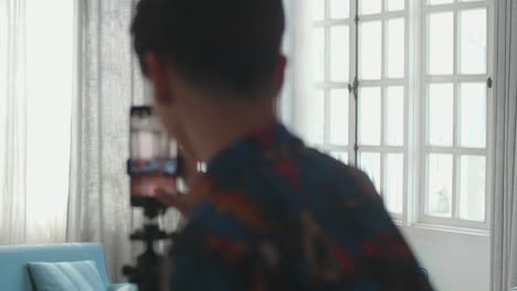 young man vlogging