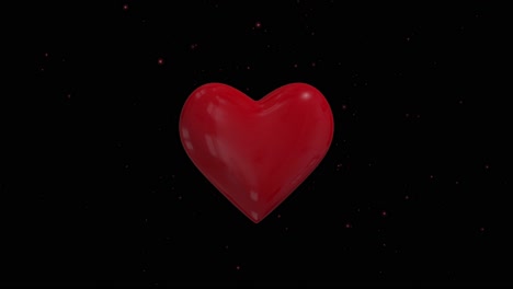 un corazón rojo sobre un fondo negro