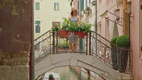 female tourist walking on brick bridge