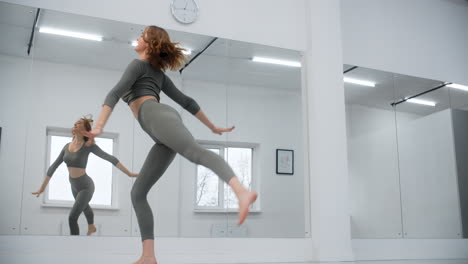 woman jumping jacks in a gym