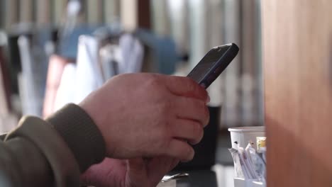 people hand hold a smartphone and touch the screen