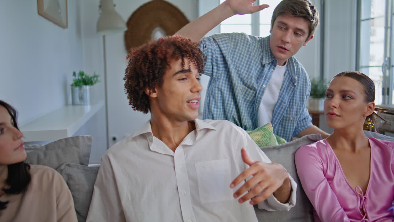 Joyful buddies partying together home gathering closeup. Happy friends talking