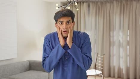 shocked indian man watching something