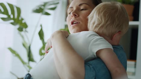 video of mother embracing her anxious toddler.